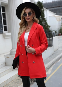Detail of red mid-length double-breasted blazer with metallic buttons and lace trim accents