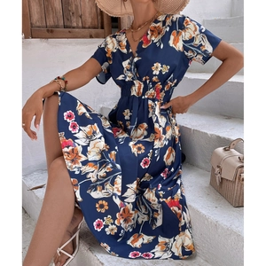 Detail of navy blue floral summer dress featuring V-neckline and elastic high waist
