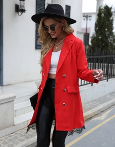 Detail of red mid-length blazer with double-breasted buttons and black eyelash lace hem