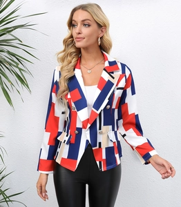 Detail of colorful geometric print blazer featuring silver double-breasted buttons and lapels