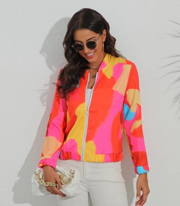 Close-up of women's slim fit zip jacket with vibrant abstract prints and elastic cuffs