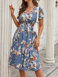 Detail of the V-neck design and floral print on a summer A-line dress for women