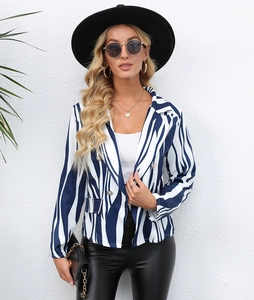 Detailed view of blue and white striped blazer with double-breasted buttons and lapels