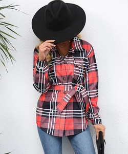 Detail of red and black buffalo plaid shacket with waist tie and button-down front