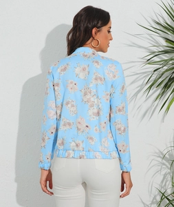 Close-up back view of floral light blue jacket featuring elastic hem and collar detail