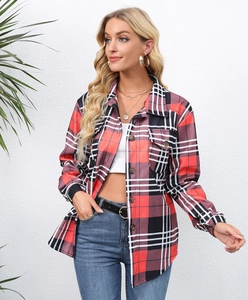 Close-up of red and black plaid flannel shirt with buttoned flap pocket and collar detail