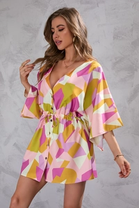 Close-up of deep V-neck and drawstring waist on geometric print summer dress