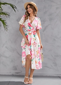 Detail of floral wrap dress with V-neckline and tropical print for summer vacation style