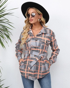 Detail shot of long sleeve plaid shirt jacket with buttons and waist belt design