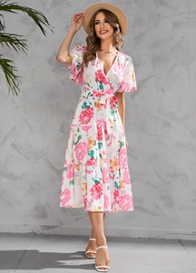 Detail of floral V-neck midi dress with tiered skirt and ruffled sleeves in a summer look
