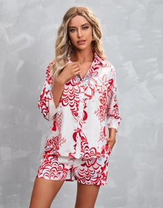 Detail of red and blue floral print on women's pajama set with side pocket shorts