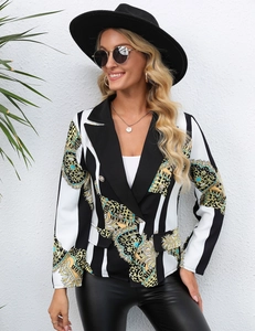 Close-up of baroque gold print and black contrast lapel on striped blazer