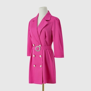 Detail of hot pink blazer dress showing sparkling rhinestone buckle and waist belt