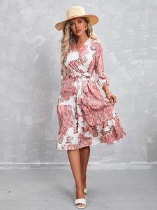 Detail of V-neck floral print maxi dress with bohemian patterns and tie waist design