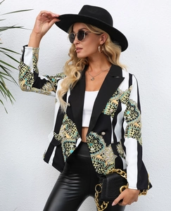 Detail of baroque print blazer with gold crests, stripes and metallic double-breasted buttons