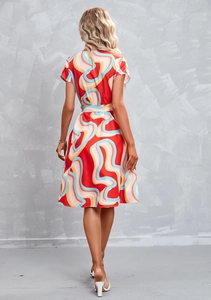 Back view of elegant red short sleeve floral dress with artistic wavy print and waist tie
