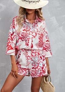 Close-up of summer two-piece set featuring vibrant red and blue floral print with button shirt