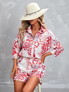 Detail of floral two-piece set featuring long sleeve button shirt and matching shorts