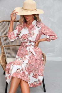 Detail of bohemian paisley print dress with V-neck wrap design and waist tie