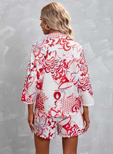 Rear view of a two-piece women's set featuring red floral print shirt and shorts