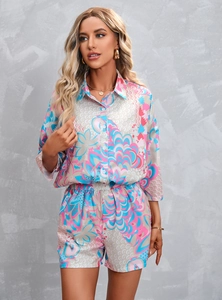 Detail of the colorful abstract geometric pattern on women's shirt and shorts set