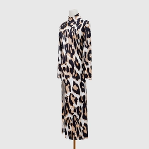 Detail of elegant leopard print long sleeve dress with high neck and sexy side slit
