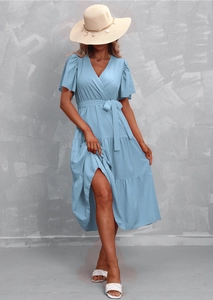 Detail of light blue V-neck dress with ruffle sleeves and tiered skirt structure