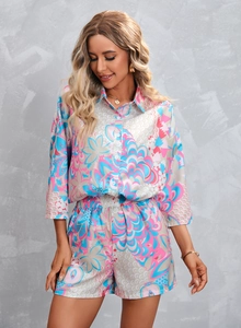 Detailed pattern of bohemian two-piece set with floral geometric prints on light fabric