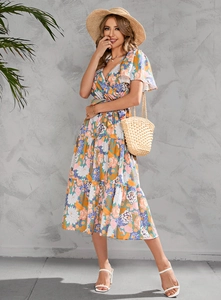 Detail of floral wrap midi dress featuring V-neckline and ruffled short sleeves for summer