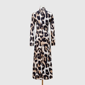 Detail view of the back of a zebra print long sleeve dress with high neck and slim fit