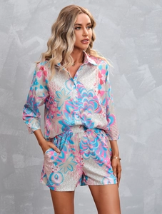 Detail of colorful abstract geometric pattern on women's lightweight shirt and shorts set