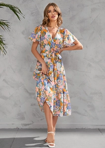 Detailed view of the V-neck floral print dress with layered skirt and ruffle sleeves