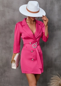 Detail of rose red blazer dress featuring silver embossed buttons and rhinestone belt buckle