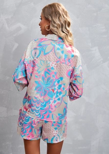 Back view of bohemian print two-piece set featuring satin shirt and elastic shorts