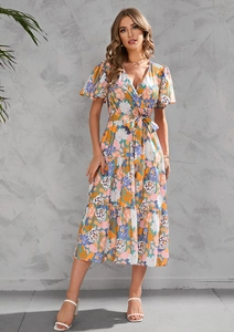 Detail of V-neck floral summer dress with tiered ruffle hem and waist tie closure