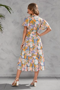 Detailed back view of women's floral tiered midi dress with cinched waist and ruffles