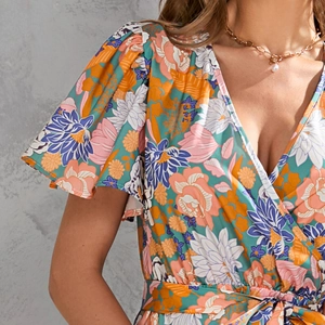 Detail of V-neck floral midi dress with ruffle sleeves and tropical flower pattern