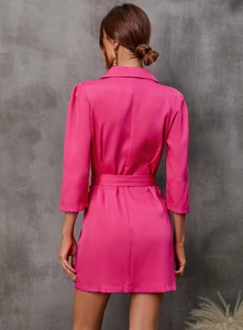 Back view of a vibrant magenta blazer dress with three-quarter sleeves and a tied waistline