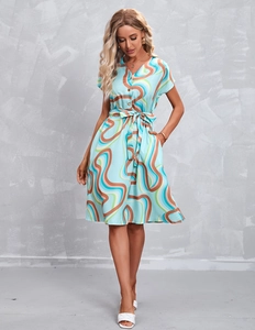 Detail view of V-neck printed summer dress with self-tie waist and side pockets
