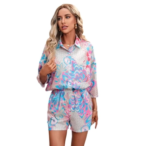Women's 2-piece summer set with vibrant geometric print shirt and matching shorts