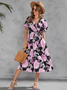 Detail of floral V-neck midi dress with waist tie and bohemian bamboo handbag accessories