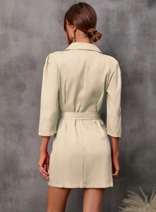 Rear view of beige quarter-sleeve blazer dress with belted waist for elegant fit