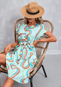 Detail of elegant V-neck light blue floral print dress with stylish metal front buttons