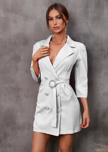 Close-up of white blazer dress with rhinestone belt buckle and silver double-breasted buttons