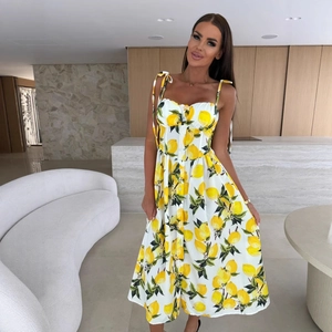 White summer sundress with lemon print featuring tie straps and button-down front style