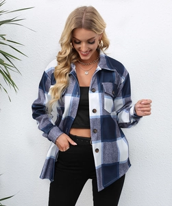 Detail of blue and white plaid brushed shirt jacket with chest pockets and button front