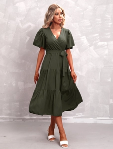 Detail of V-neck dark green tiered dress with ruffled sleeves and adjustable waist tie