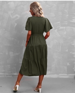Back view of a dark green tiered midi dress with short sleeves and a matching waist tie