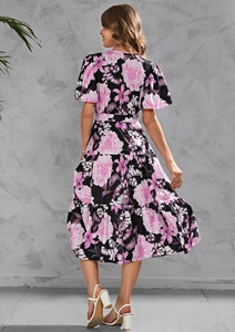 Back view of a tiered floral midi dress with V-neck, waist tie and pink peony prints