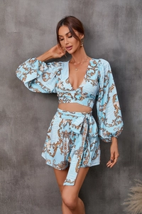 Detail of blue baroque floral print v-neck long sleeve top and high waist shorts set